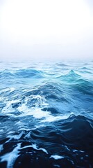 Fototapeta premium Vast ocean waves in shades of blue, creating a serene and calming atmosphere. The sunlight softly illuminates the water surface, enhancing its tranquil beauty.