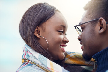 Outdoor, black couple and dating with smile for love, vacation holiday and bonding together. Happy people, man and woman with trust embrace for admiration, connection and anniversary for relationship