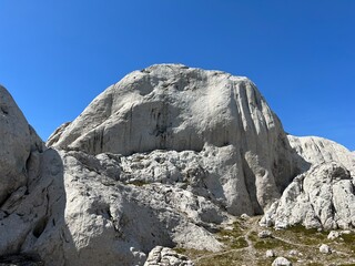 Rocky ridge of Tulove grede or karst mountain peak of Tulovice - Velebit Nature Park, Croatia (Stjenoviti greben Tulove grede ili krški planinski vrh Tulovice - Park prirode Velebit, Hrvatska)