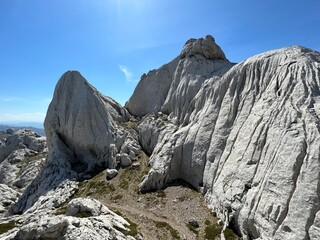 Rocky ridge of Tulove grede or karst mountain peak of Tulovice - Velebit Nature Park, Croatia (Stjenoviti greben Tulove grede ili krški planinski vrh Tulovice - Park prirode Velebit, Hrvatska)