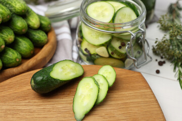 Fresh cucumbers on light table, closeup. Preparation for pickling
