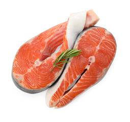 Two fresh salmon steaks and rosemary isolated on white, top view