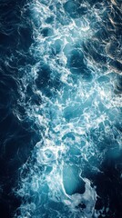 Fototapeta premium Aerial View of White Foam on Blue Ocean Water