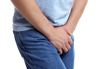 STD (sexually transmitted diseases). Man suffering from symptoms on white background, closeup
