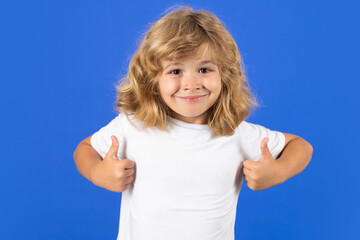 Fototapeta premium Portrait of cute smiling child, isolated studio background. Happy kid, happy and smiling emotions.