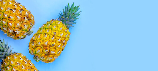 Fresh pineapple on blue background.
