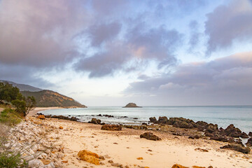 rocky tropical beach in Portugal at sunset