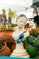 Statue bust in a rooftop garden in Portugal
