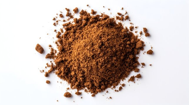 Ground cumin spice in a small mound showcasing the earthy tones and rich texture of the powdery seasoning against a clean white background