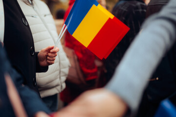 People Waving Flags at the Great Union Day parade in Romania. Crowd marching and celebrating the national Romanian day 
