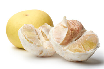 closeup of pomelo or shaddock fruit, largest citrus fruit with pale yellowish flesh chinese grapefruit or bali lemon isolated white background