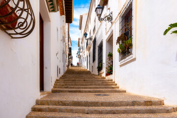 Obraz premium A traditional mediterranean alley in Altea old town, Costa Blanca, Spain