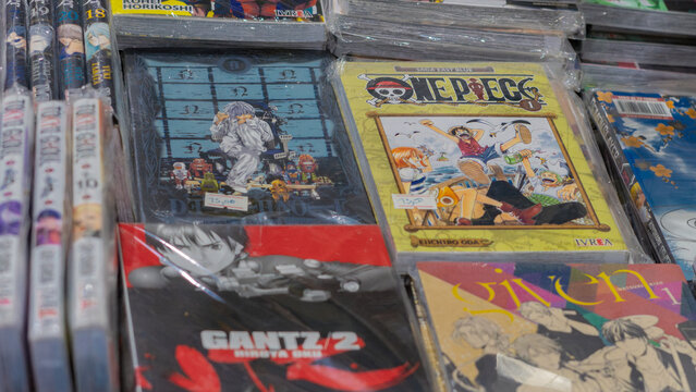 8th Comic Con Convention In GUAYAQUIL, ECUADOR - AUG 06, 2023 - Display of various manga series like One Piece, Tokyo Ghoul, and Death Note, showcasing popular titles for anime and manga fans.
