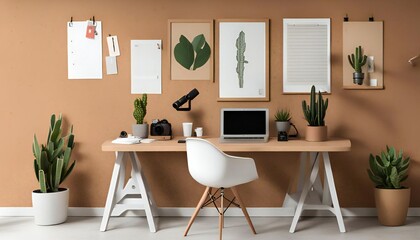 This image features a modern, minimalist desk with a laptop, a white chair, and a variety of potted plants, as well as framed pictures on the wall..jpg
