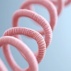 A close-up view of a pink spiral coil against a soft background.