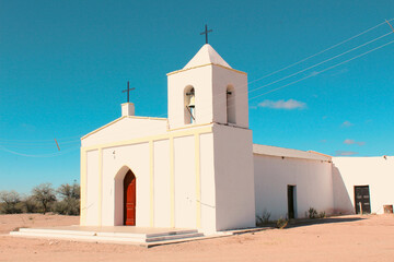 The warm hues of adobe homes blended harmoniously with the arid landscape, creating an enchanting...