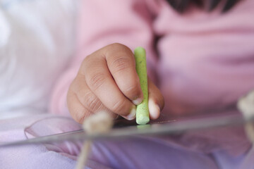 A Child Happily Engaged in Creative Play with Their Tablet Exploring New Activities and Ideas