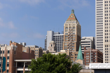 Tulsa, Oklahoma, USA - June 25, 2023: Afternoon sun shines on historic buildings of downtown Tulsa.
