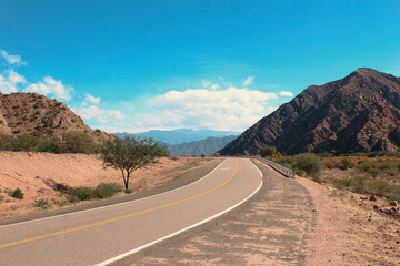 Concrete road into the mountains wilderness