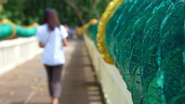 Green Naga body on the walkway to Wat Kham Chanod in Udon Thani Province, Thailand.
