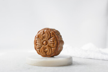 homemade mooncakes on a white background, top view of baked mooncakes on white table, process of making mooncakes for Lunar New Year and mid autumn festival