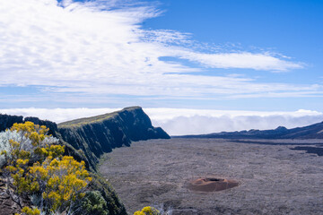Reunion Island has a desolate volcanic plain called the "Plaine des sables". This barren land is often compared to the surface of the moon but is a popular hiking destination. France.