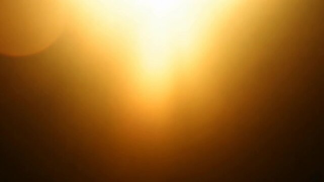 Golden Light Abstract:  A captivating abstract background featuring a soft, ethereal glow of golden light radiating outwards. This image evokes a sense of warmth, hope, and optimism.
