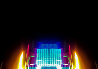 Abstract light art background with dynamic movement is the result of light painting photography capturing speed and energy with elegant lines of light.