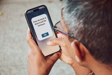 A South Asian man got his social media account restricted for 24 hours message on the mobile phone....