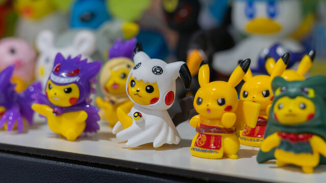 8th Comic Con Convention In GUAYAQUIL, ECUADOR - AUG 06, 2023 - Colorful Pikachu figurines in unique costumes, inspired by Pok&eacute;mon anime, perfect for collectors and anime enthusiasts.