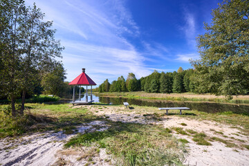 Tranquil Waterfront Gazebo on Sunny Day