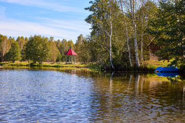 Tranquil Waterfront Gazebo on Sunny Day