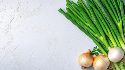 A photostock of fresh spring onions on a white background, isolated and green.