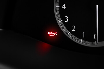 The red engine oil pressure light , engine oil light blinking malfunction on car instrument panel...