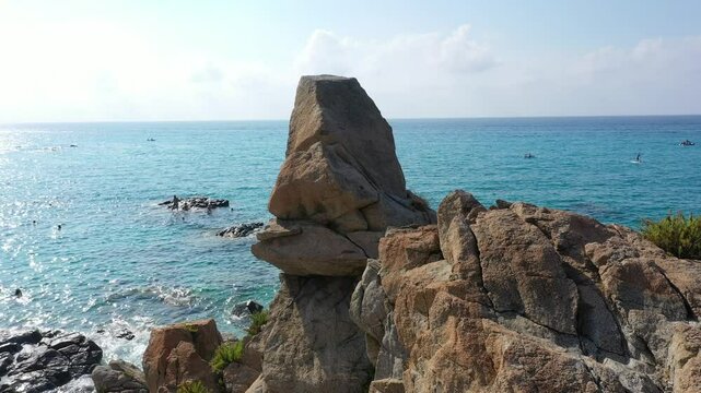 Aerial view of sea and rocky beach in Marinella Di Zambrone on a sunny summer day in Calabria, Italy