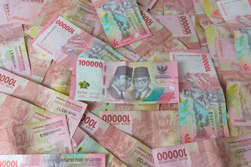 Stack of One Hundred Thousand Rupiah Banknotes. Background photo of one hundred thousand rupiah banknotes. Indonesian Currency