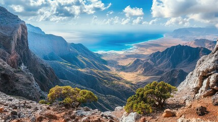Fototapeta premium Scenic view of the captivating landscapes of Socotra Island, with rolling hills and valleys leading down to the azure sea. No people included.