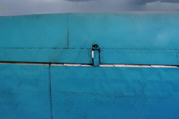 View of the wing of an old airplane.