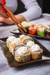 Delicious and fresh rolls with sauce