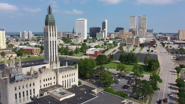 Tulsa, Oklahoma, USA - June 25, 2023: Afternoon sun shines on historic buildings of downtown Tulsa.