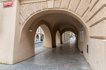 Fototapeta premium Tunnel passage under an old house on Tomashska Street in historical part of the Prague in the Czech Republic