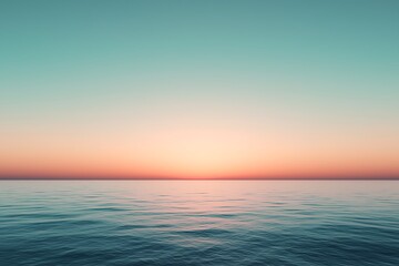 Fototapeta premium A serene sunset over calm ocean waters, showcasing a gradient sky in soothing hues of blue and orange, evoking tranquility and natural beauty.