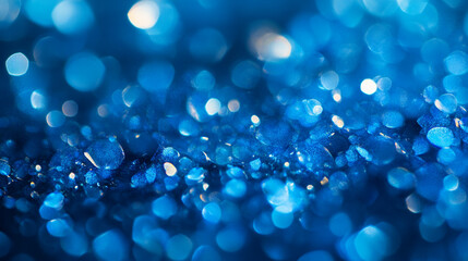 Glittering blue crystals shine under soft lighting in a close-up view captured indoors
