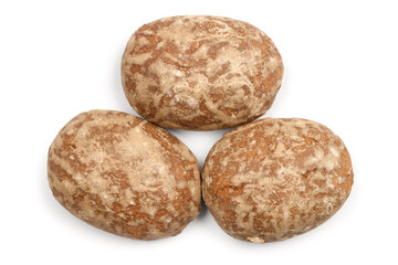 Three ordinary round gingerbread cookies on a white background. Gingerbread close-up top view.
