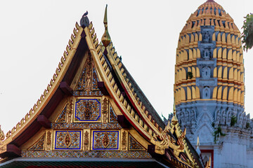 Background of morning light in the religious tourism area in Phitsanulok, Thailand. Wat Phra Si Rattana Mahathat Woramahawihan has an old church and beautiful Buddha statues.