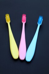 Toothbrush isolated on dark background, close up view.