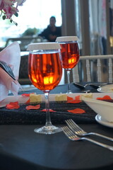 Holidays romantic, dinner table and setting for valentines day, fine dining or date at indoor night restaurant. Interior diner for evening couple reservation