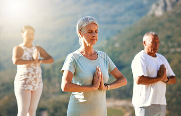 Yoga, namaste and woman meditate outdoor for fitness, body health or peace with class. Group, calm...