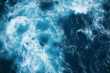 Obraz premium Deep blue ocean water with swirling waves and splashes. Top view of vibrant seascape with sea water