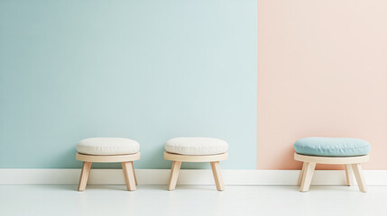 Fototapeta premium Stylish stools against a pastel wall in a modern interior design setting